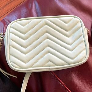 Mint green stylish purse, mint green straps with gold chains, 1 zipper, no defec